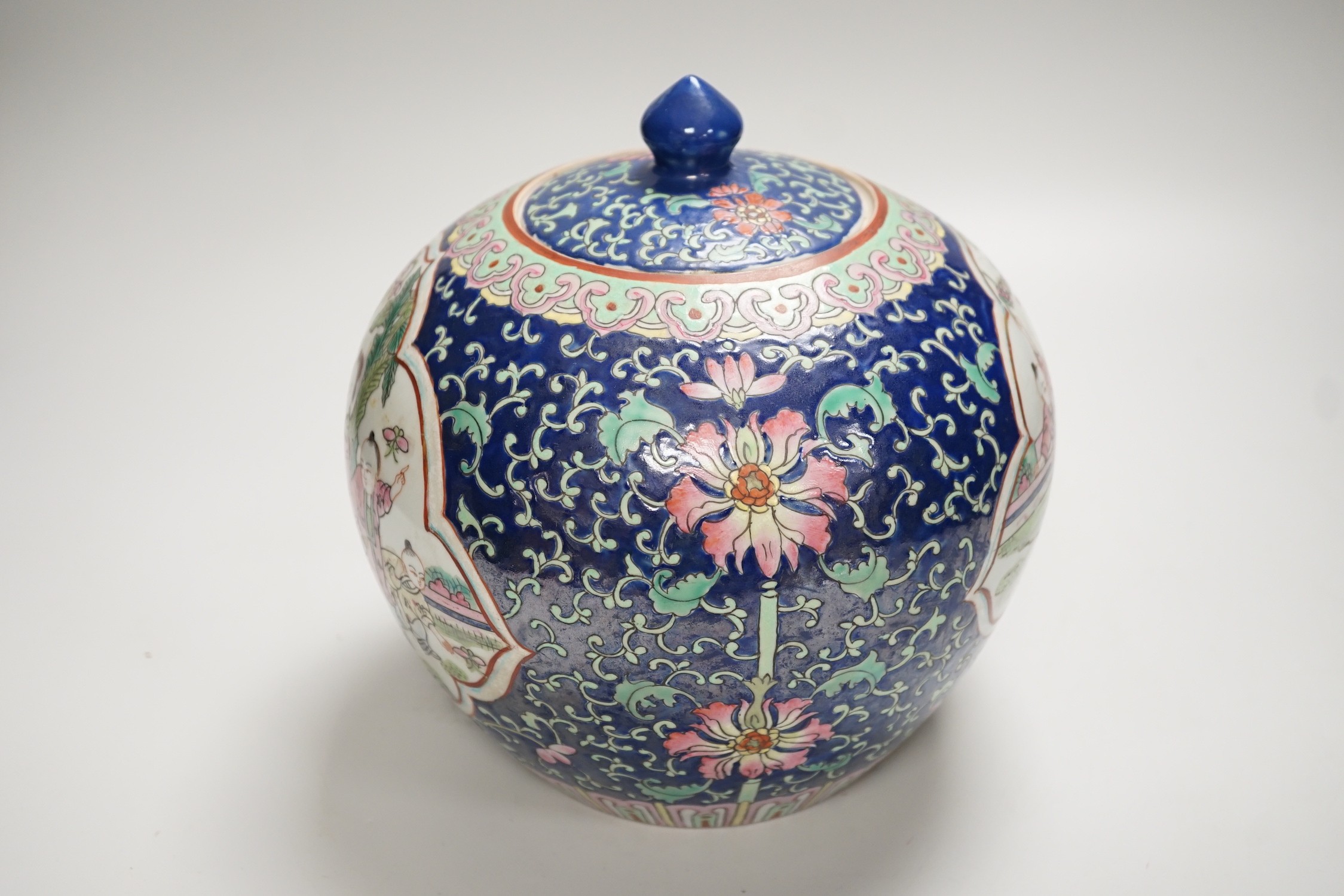 A Chinese famille rose jar and cover, 20cm high